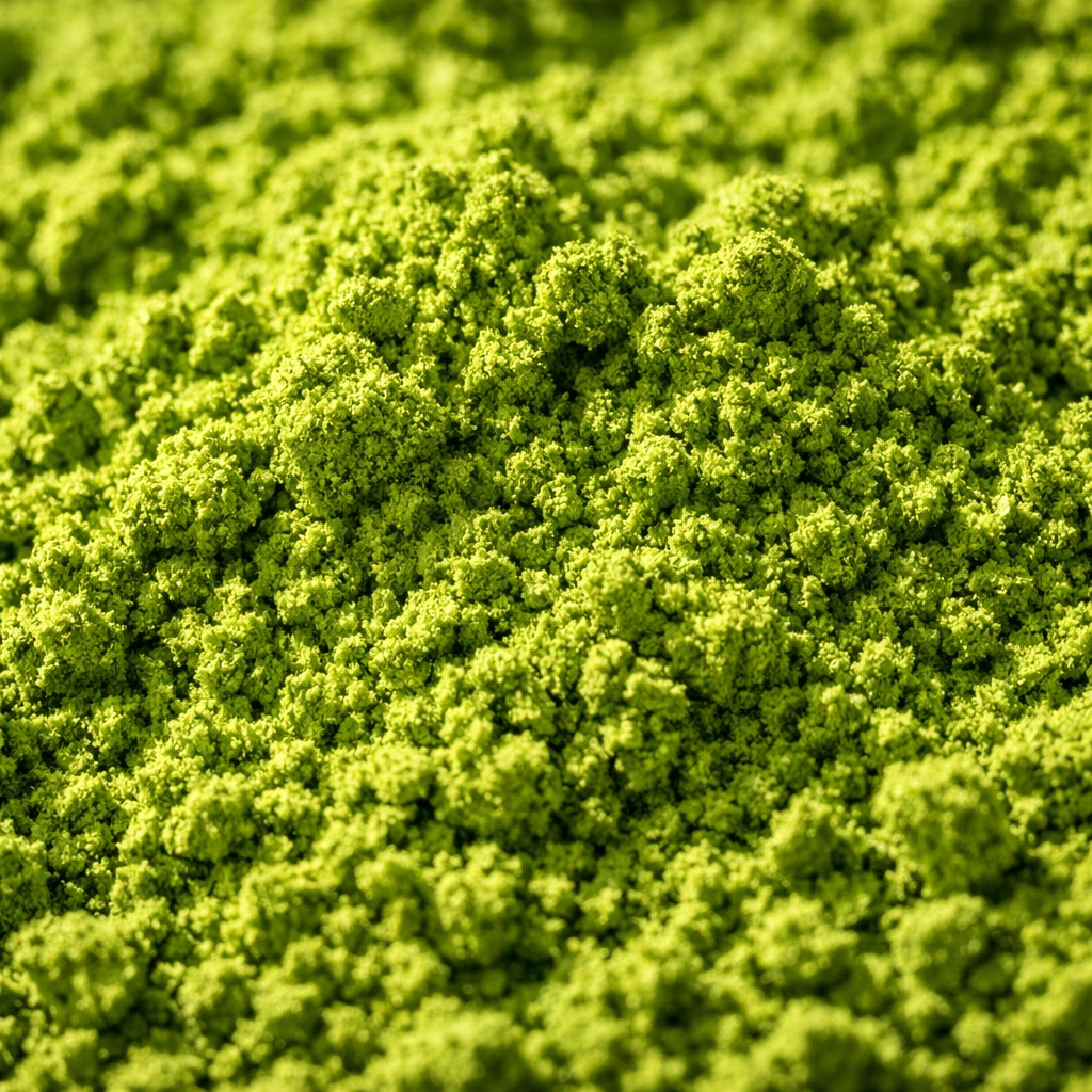 Close-up of vibrant green matcha powder showing fine silky texture